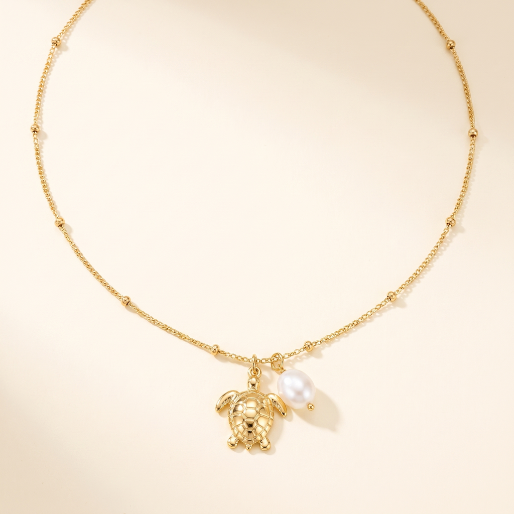 Collar Tortuga Perla con charms de tortuga y perla blanca