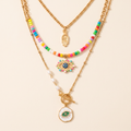Collar Nazar Trío con tres collares de ojo turco y mano de fátima