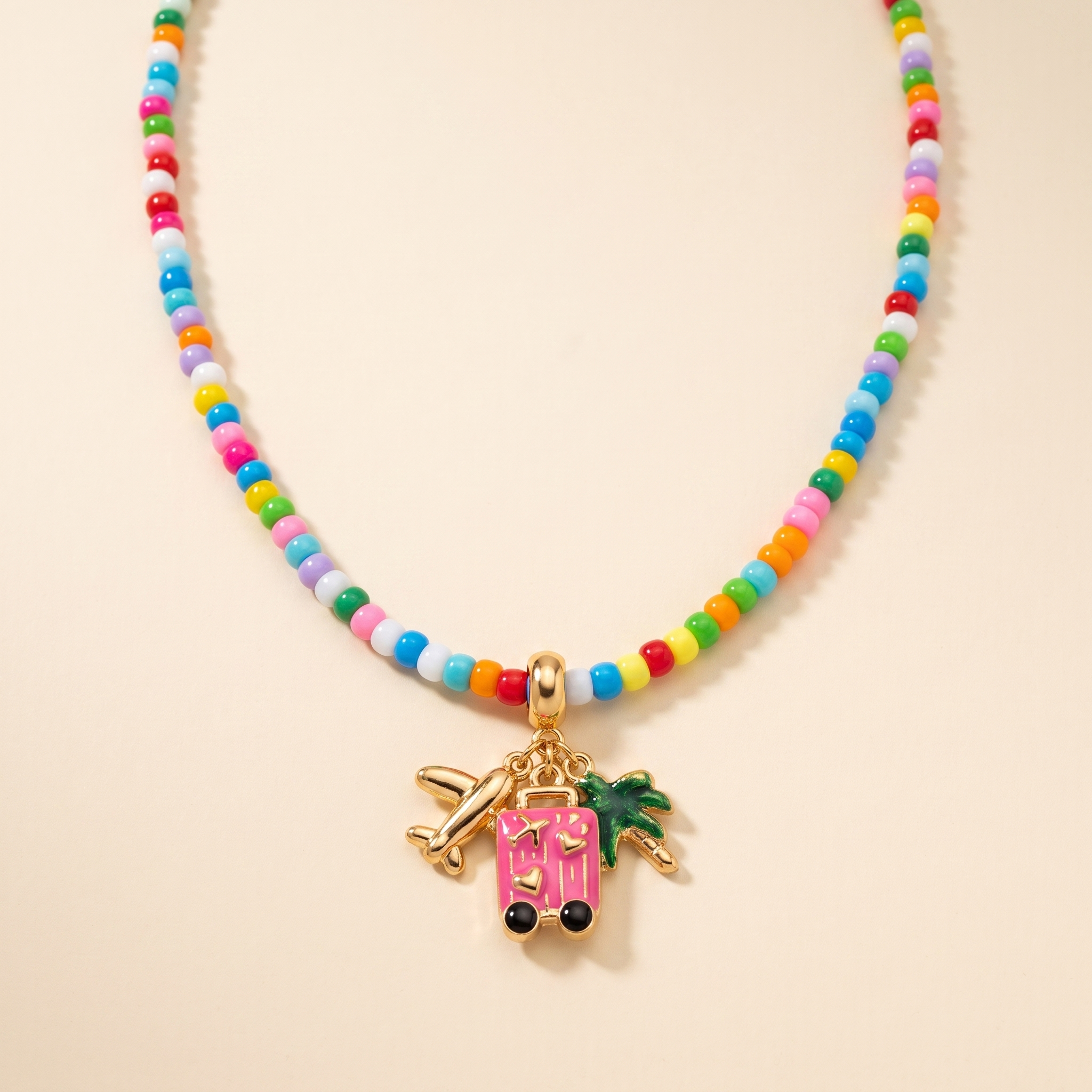 Collar Confetti Avión de mostacilla multicolor con charms de viaje