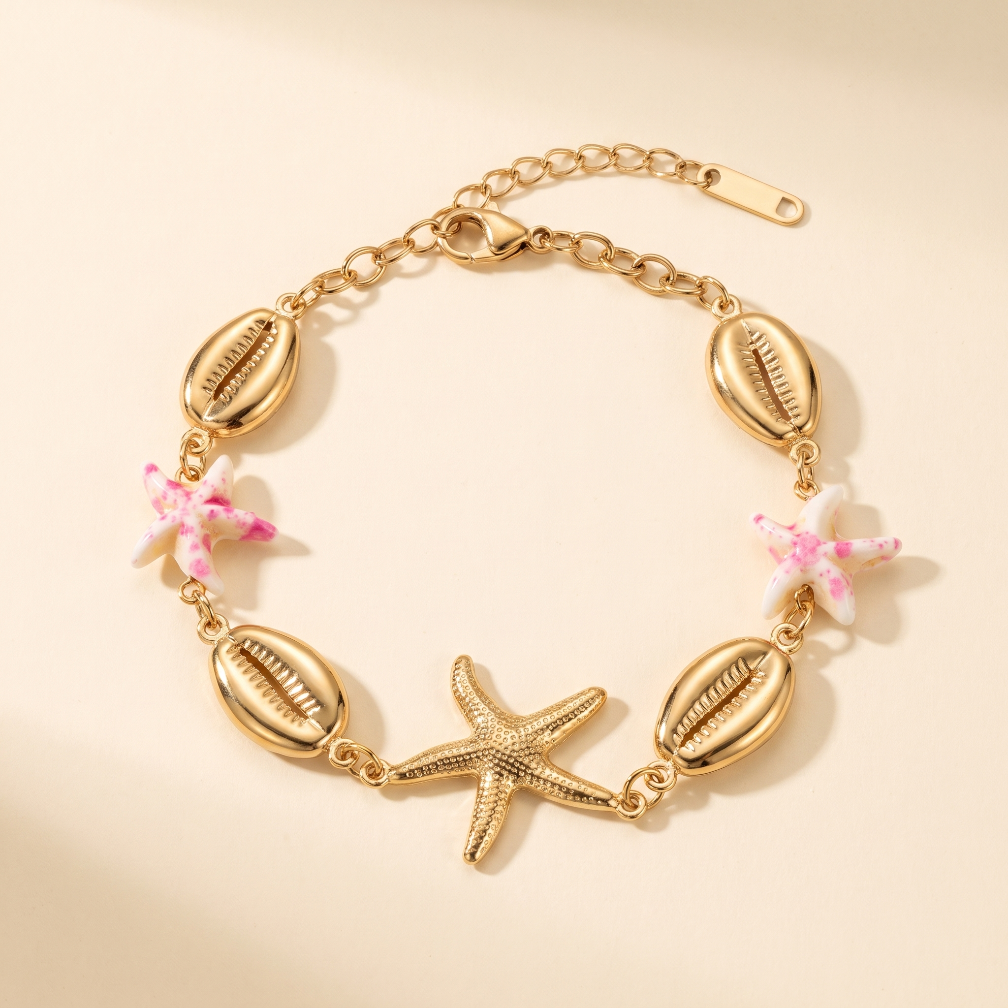 Pulsera Concha Estrella con conchas doradas y estrellas rosas