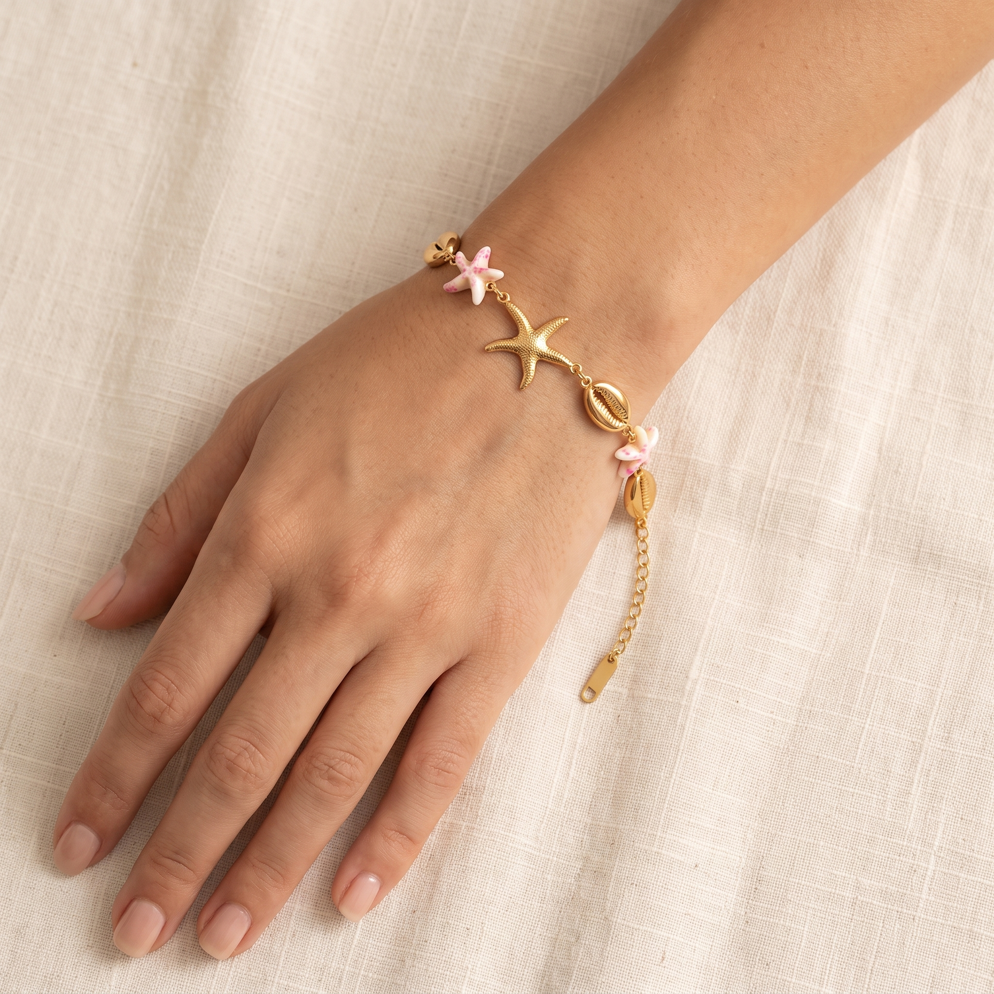 Pulsera Concha Estrella con conchas doradas y estrellas rosas