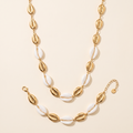 Set Marea Blanco con collar y pulsera de conchas doradas y blancas